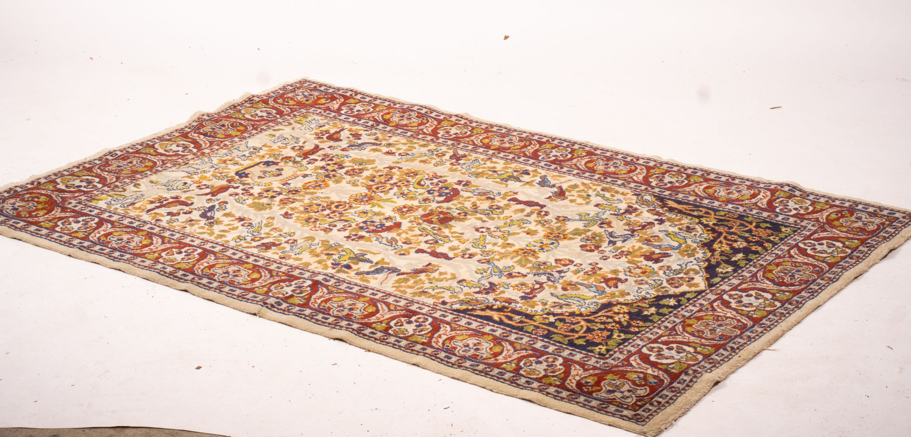 A North West Persian ivory ground 'tree of life' rug, 178 x 125cm